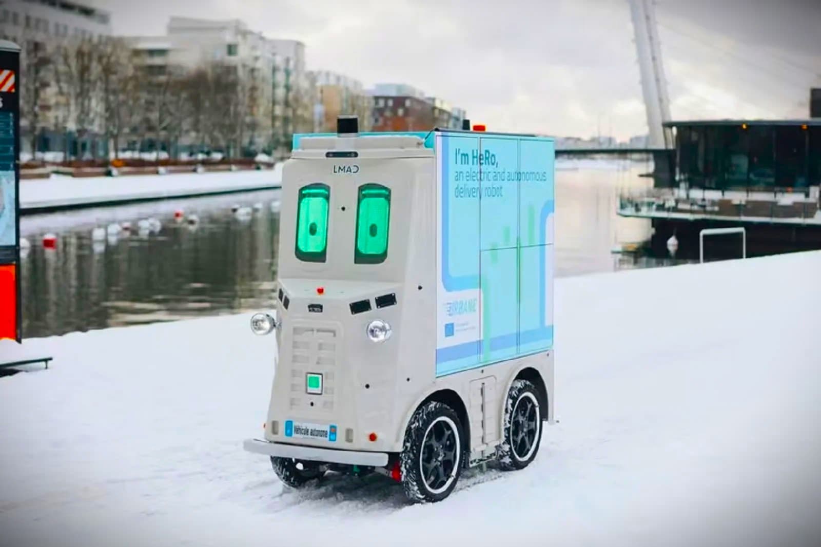 A funny talking robot delivery driver goes through the streets of Helsinki