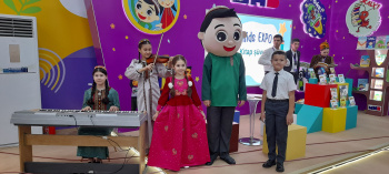 Piano in the bushes at Kids expo: young musicians performed at a children's exhibition in Ashgabat